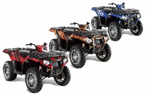Polaris Sportsman quads shown in three custom graphic kit looks